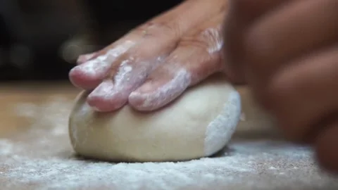 Cinematic close up kneading dough on table by professional artisan baker ba.. Stock Footage 272466842