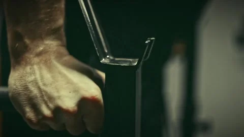 Cinematic Close-up of a Man Performing Dips on Parallel Bars Stock-Footage 329764269