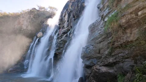 Cinematic Close-Up Panning Shot Of Waterfall Mist Flowing In Warm Sunlight Stock Footage 340470208