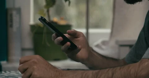 Cinematic close up of person typing message on smartphone Video stock 345921318