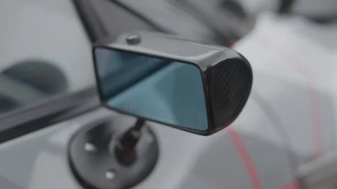 Cinematic close-up of a racing side mirror on a supercar Stock Footage 335075660