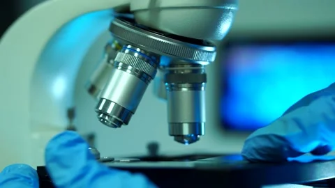 Cinematic Close Up Of Scientist Preparing A Microscope For Research Stock Footage 138555501