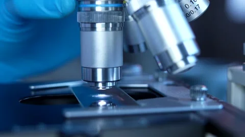 Cinematic Close Up Of Scientist Preparing A Microscope For Research Stock Footage 168424237
