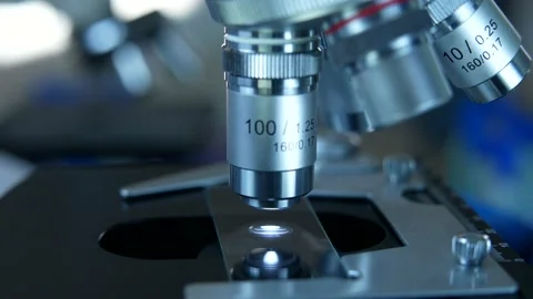 Cinematic Close Up Of Scientist Preparing A Microscope For Research Stock Footage 168424255