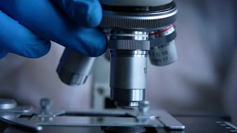 Cinematic Close Up Of Scientist Preparing A Microscope For Research Stock Footage 190988824