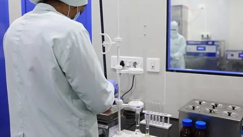 The cinematic close up seen of chemist is being the process of pharma syrup in Video stock 304845917