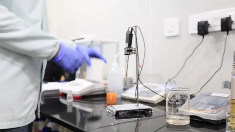 The cinematic close up seen of chemist is being the process of pharma syrup in Video stock 304862957