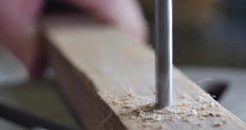 Cinematic close shot of drill bit drilling in piece of reclaimed wood, handmade Video stock 140937165