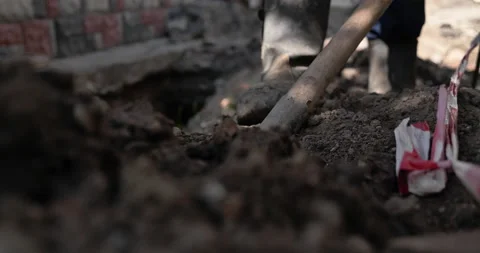 Cinematic close up shot of farmer digging ground with shovel  Stock-Footage 202025588