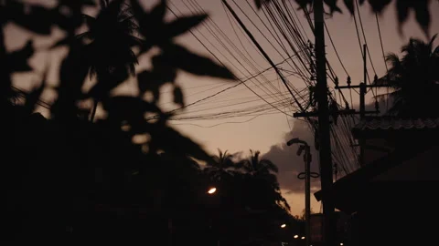 Cinematic Close-up of Tangled Power Lines and Utility Pole Against Ethereal Stockbeeldmateriaal 335713773