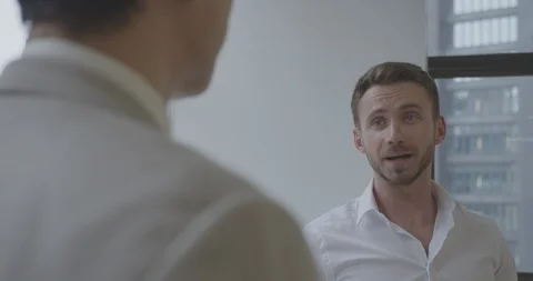 Cinematic close up of two men making deal Stock Footage 93357585