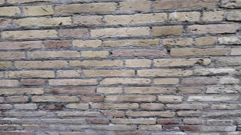 Cinematic Close-Up Of The Weathered Texture Of An Ancient Roman Brick Wall Stock Footage 336280396