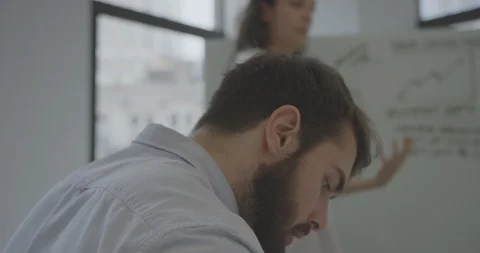 Cinematic closeup of attractive creative taking notes during meeting Video stock 93202506