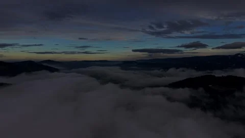 Cinematic clouds moving through alpine terrain Stock Footage 328494030