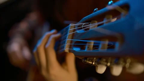 Cinematic coloured studio light, hands plays classic guitar. Stock Footage 267734543