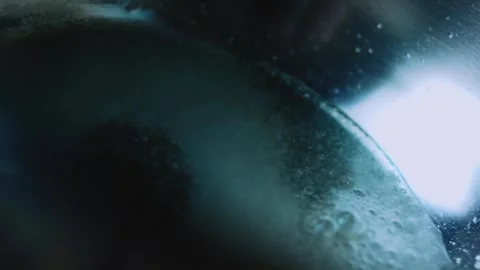 Cinematic cooking study of sugar bubbles forming across the saucepan Stock Footage 342153670