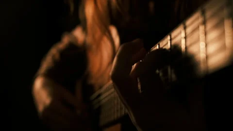 Cinematic dark key light, professional teen hands playing classical guitar Video stock 308915609