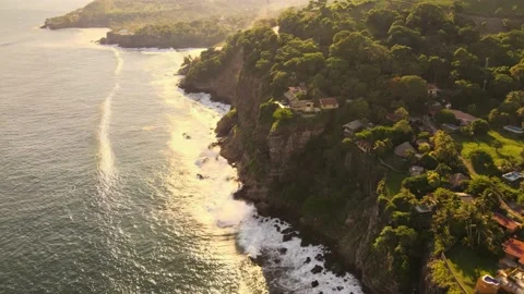 Cinematic Descending Cliffs into the Ocean Break Stock Footage 161422134
