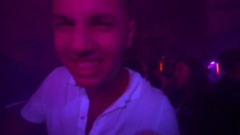 Cinematic  Diverse Group of Friends Dancing in Vibrant Purple Nightclub 4K Vídeos de archivo 329226608