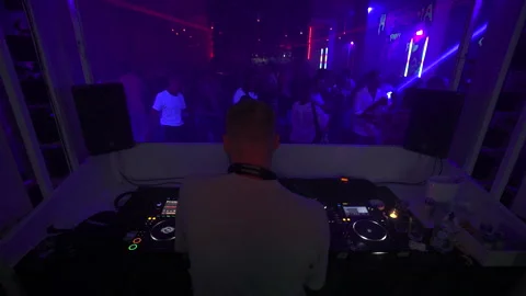Cinematic DJ Mixing Live Set for Nightclub Crowd wide shoot 4K Video stock 329226061
