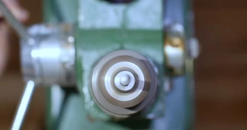 Cinematic down view of drill chuck and drill bit. the drill is for wood working Stock Footage 140934308