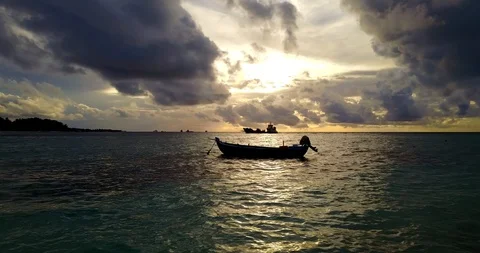 Cinematic dramatic sunset with big dark clouds trying to hide the sun, Stock Footage 119194188