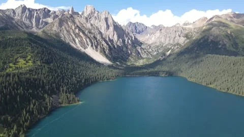Cinematic Drone Circle Over Blue Alpine Lake in Cuopu Valley China Stock Footage 330279575