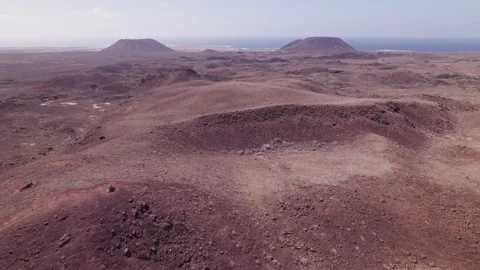 Cinematic Drone Clip Over Red Volcanic Hills in Fuerteventura Stock Footage 309656084