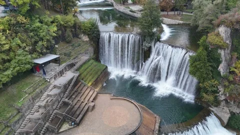 Cinematic Drone Descent Over the Powerful Pliva Waterfall and River Stock Footage 331864143