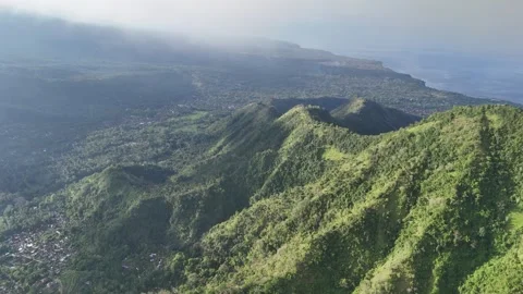Cinematic Drone Flight Into Clouds Over Lush Green Jungle Ridge in Bali Stock Footage 321148410