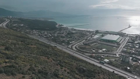 Cinematic Drone Flight from Mountain Canyon to Coastal City - 4K Stock Footage 331892057