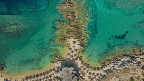Cinematic drone flight over a bustling beach cove Stock Footage 263156017