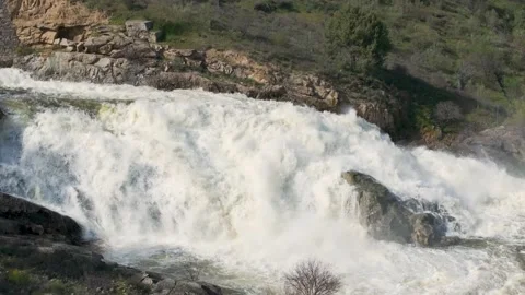 Cinematic drone flight over dam spillway waterfall crashing on rocks Vidéo 331155659