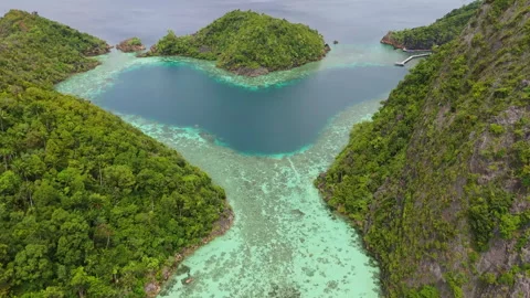 Cinematic Drone Flight Over Heart Shaped Lagoon Misool 4K UHD Stock Footage 337963907