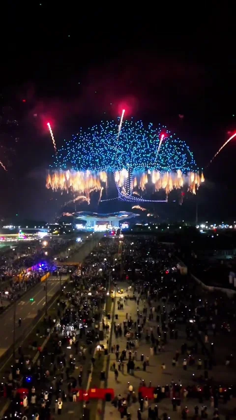 Cinematic Drone Flight Over Massive Crowd Toward Spectacular Colorful Firewo Stock Footage 329142193
