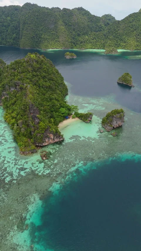 Cinematic Drone Flight Over Remote Misool Coastline 4K UHD Stock-Footage 336985444