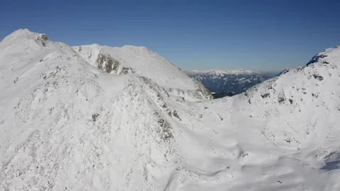 Cinematic Drone Flight Over Snow Covered Mountain Range and Valleys Stock Footage 332127414