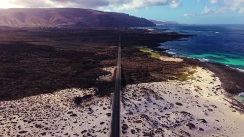 Cinematic Drone Flight Over Winding Coastal Road, Lanzarote LZ-1 Stock Footage 325717934
