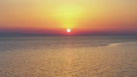 Cinematic drone flight into the sunset over the sea Stock Footage 264424650