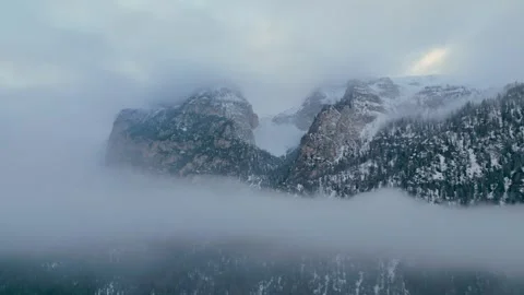Cinematic drone fly-through above clouds in the Dolomites alpine mountains Stockbeeldmateriaal 334699180