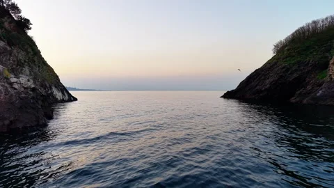 Cinematic Drone Fly-Through Between Two Islands Towards Golden Sunset Stock Footage 334246009