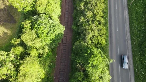 Cinematic drone fly-through descending over abandoned railway line Stock Footage 337880613