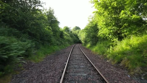 Cinematic drone fly-through over abandoned railway line Stock Footage 337880624