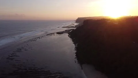 Cinematic Drone Flyover of Coastal Cliffs at Sunset in South Bali Stock-Footage 332697060