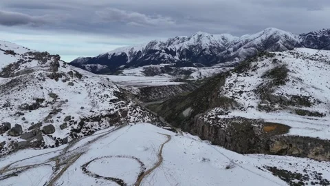 Cinematic Drone Flyover of Rugged Winter Peaks in Arthur's Pass National Park Stock Footage 314233335