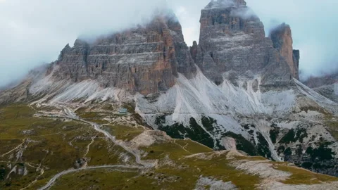 Cinematic Drone Flyover of Tre Cime di Lavaredo and Surrounding Landscape Stock Footage 312270180