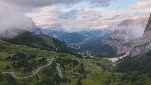 Cinematic Drone Flyover of Winding Mountain Road Through Clouds at Gardena Stock Footage 342605601