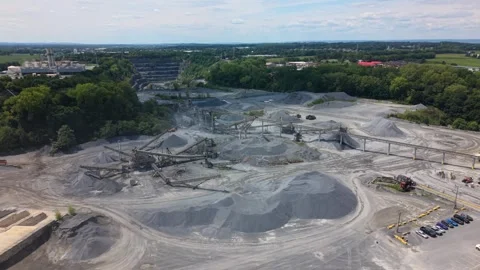 Cinematic drone footage flying over a stone quarry processing plant showing 動画素材 344955848