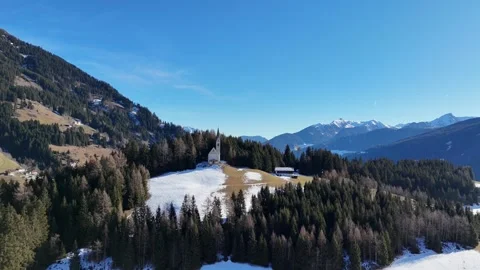 Cinematic Drone Forward Flight Toward Isolated Mountain Chapel with Snow Stock Footage 331802081