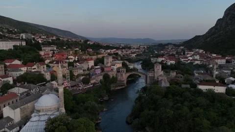 Cinematic Drone Forward Parallax of Mostar Mosque and Stari Most Bridge Dusk 4K Vídeo Stock 337830882